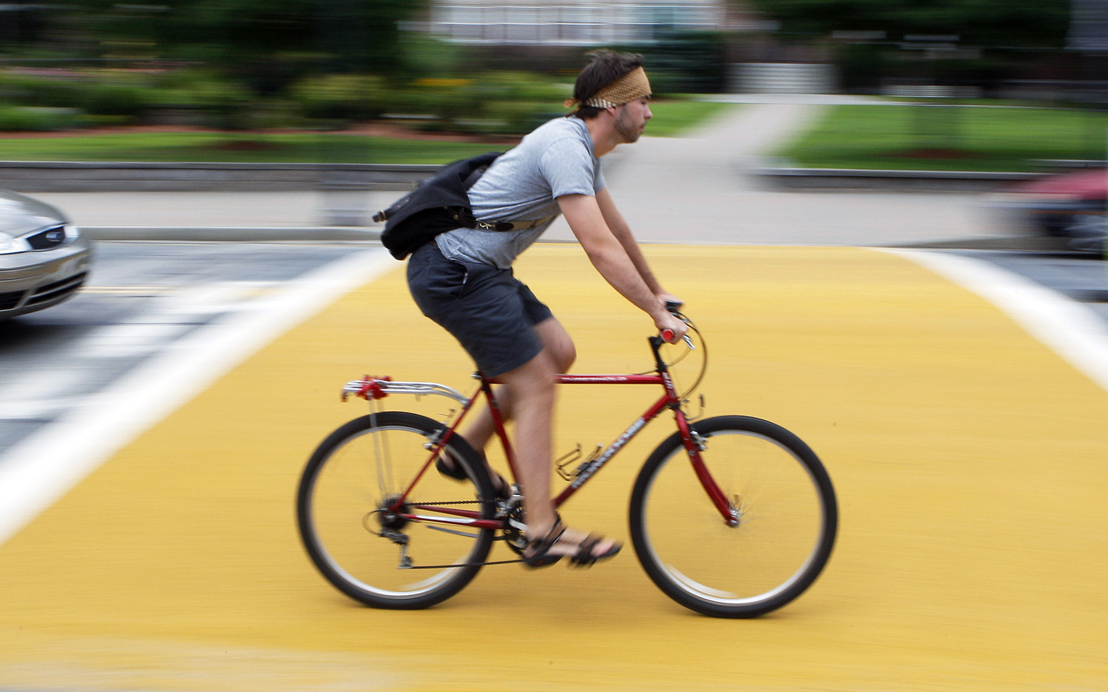 **ADVANCE FOR MONDAY, SEPT. 15, AND THEREAFTER** Eric Hultgren, 22, a senior at UMass-Lowell, rides his bicycle on campus in Lowell, Mass. Friday, August 1, 2008. Hultgren can't afford high gasoline prices, so he's ditched his car for a Mongoose 8-speed. (AP Photo/Elise Amendola)