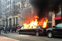 Protesters set a parked limousine on fire in downtown Washington, Friday, Jan. 20, 2017, during the inauguration of President Donald Trump. 
(AP Photo/Juliet Linderman)