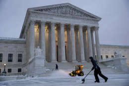 Workmen clear snow in front of the Supreme Court on Capitol Hill in Washington, Tuesday, March, 14, 2017. A late-season storm is dumping a messy mix of snow, sleet and rain on the mid-Atlantic, complicating travel, knocking out power and closing schools and government offices around the region. (AP Photo/J. Scott Applewhite)
