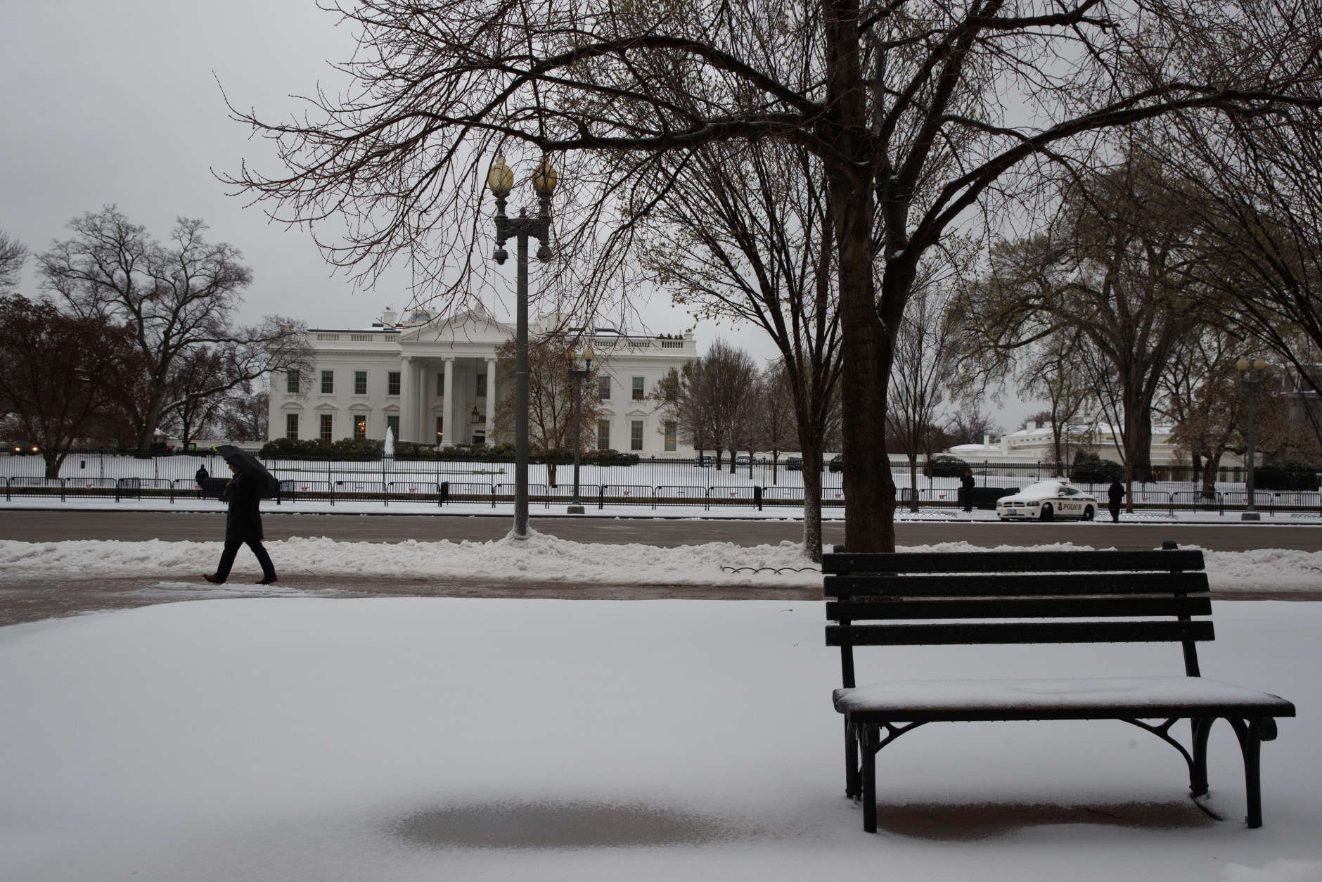 Snow covers the ground outside of the White House in Washington, Tuesday, March 14, 2017. A late-season storm is dumping a messy mix of snow, sleet and rain on the mid-Atlantic, complicating travel, knocking out power and closing schools and government offices around the region. (AP Photo/Evan Vucci)