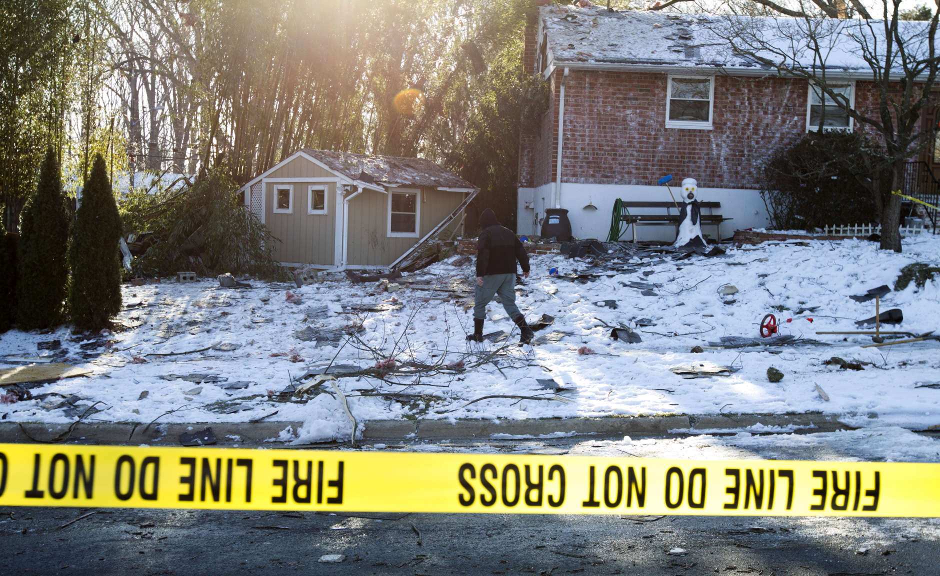 Montgomery County, Md. Police officers mark evidence near a house after an explosion in Rockville, Md., Friday, March 17, 2017. A house in a Maryland suburb of the nation's capital was leveled early Friday by a thunderous explosion heard for miles around, the blast shattering windows and causing other damage to several neighboring homes, authorities said. (AP Photo/Jose Luis Magana)