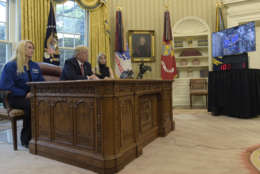 President Trump — flanked by astronaut Kate Rubins as well as daughter and adviser Ivanka Trump — speaks April 24 with astronauts Peggy Whitson and Jack Fischer (who are aboard the International Space Station). (AP Photo/Susan Walsh)