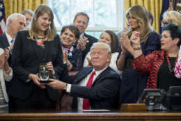 President Donald Trump presents the 2017 National Teacher of the Year award to Codman Academy ninth-grade humanities teacher Sydney Chaffee of Dorchester, Massachusetts (second from left) April 26. (AP photo/Andrew Harnik)