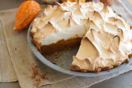 This Oct. 12, 2015 photo shows citrus pumpkin meringue pie in Concord, NH. This Thanksgiving pie is deliciously deceptive, hidden under the meringue is a classic pumpkin pie spiked with just a hint of citrus. (AP Photo/Matthew Mead)