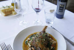 In this photo taken Monday, Feb. 1, 2016, a lamb shank dish with a Tuscan bean ragu, natural jus and gremolata is paired with Shafer Merlot and Relentless wines at the Bistro Don Giovanni restaurant in Napa, Calif. Theres some debate over whether red with beef and white with chicken and pork is an absolute or a rule made to be broken. (AP Photo/Eric Risberg)