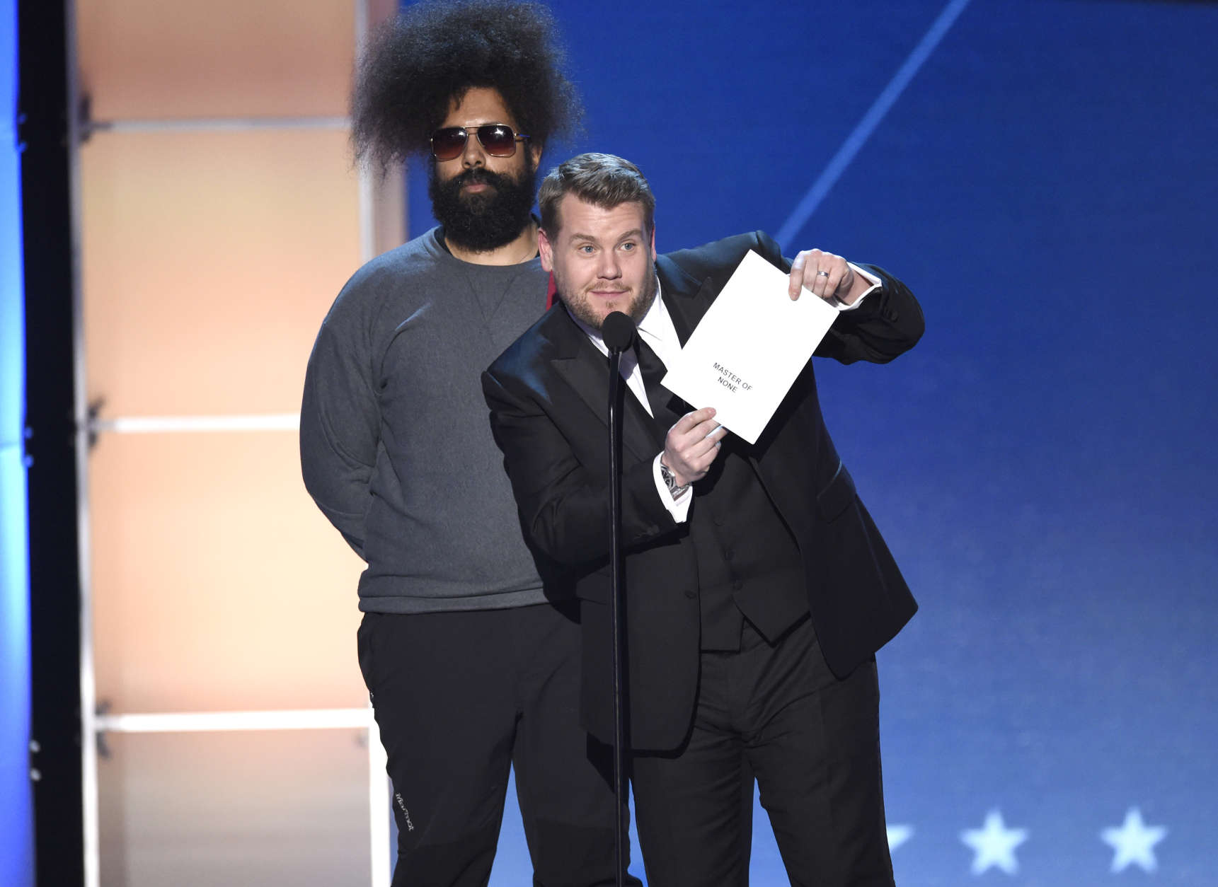 Bandleader Reggie Watts, left, is 45 on March 23. (Photo by Chris Pizzello/Invision/AP)
