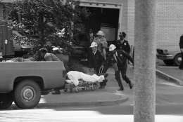 Rescue workers remove an injured person from BNai BRith is Washington on Wednesday, March 9, 1977. Armed gunmen are holding hostages inside the building, one of three locations in the nations capital where hostages have been taken. (AP Photo)