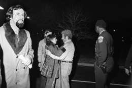 A man spots and embraces a woman who was among several hostages sent to George Washington hospital following their release by gunmen in Washington on Friday, March 11, 1977. The terrorists held up to 135 persons in three different buildings. (AP Photo)