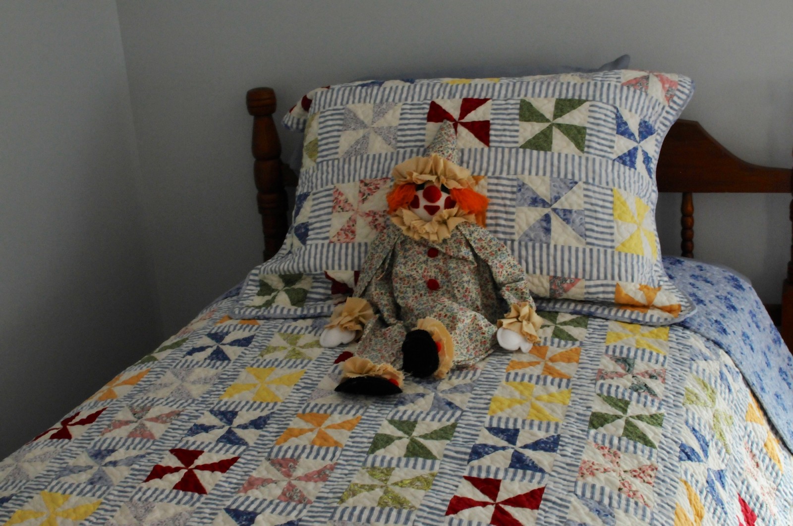 A doll rests on a bed in "The Waltons" house. (WTOP/Ed Kelleher)