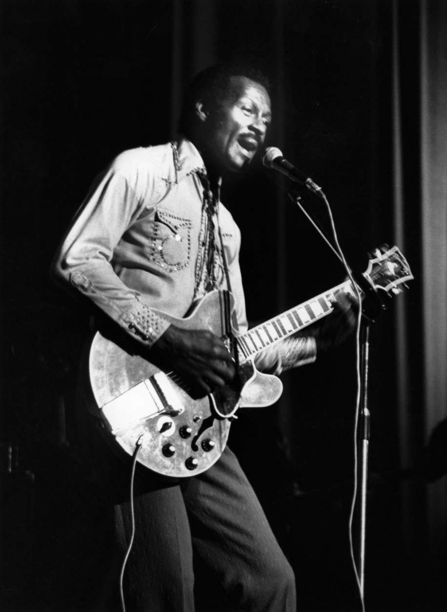 6th May 1977:  Hugely influential singer, songwriter and guitarist Chuck Berry, (Charles Edward Anderson), performing on stage with his guitar at the Birmingham Odeon in England.  (Photo by Keystone/Getty Images)