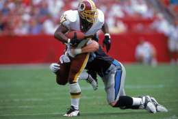 3 Sep 2000: Larry Centers #37 of the Washington Redskins tries to get out of a tackle during a game against the Carolina Panthers at FedEx Field in Landover, Maryland..  The Redskins defeated the Panthers 20-17.Mandatory Credit: Ezra O. Shaw  /Allsport