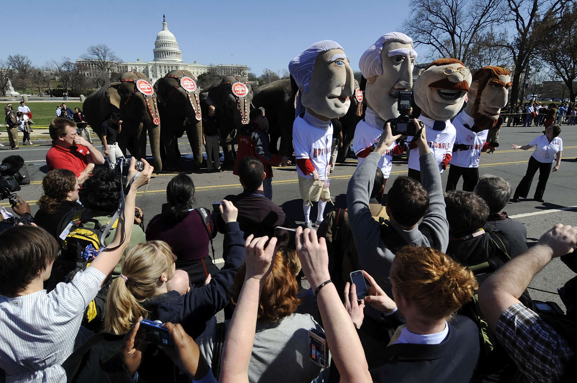 WASHINGTON - MARCH 16:  The Rushmores - mascots for the Washington Nationals MLB baseball team in the guise of former U.S. Presidents George Washington, Thomas Jefferson, Abraham Lincoln and Theodore Roosevelt - get in on the act as elephants from the Ringling Bros. and Barnem &amp; Bailey Circus stop near the U.S. Capitol for a photo op as they parade through town to announce the circus's arrival for performances on March 16, 2010 in Washington, DC. The circus' Zing Zang Zoom Red Tour will be at the Verizon Center from March 18 to March 21.  (Photo by Jonathan Ernst/Getty Images)