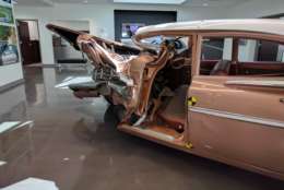 A 1959 Chevrolet Bel Air and a 2009 Chevrolet Malibu are on display in the IIHS Vehicle Research Center's lobby, demonstrating the advances in vehicle safety over the last several decades. (WTOP/Ginger Whitaker)