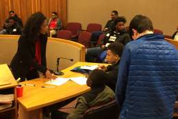 Through the DC Youth Law Fair students explored serving as judges, jury members and attorneys as they worked on a mock case that involved a 15-year-old girl who sent intimate photos of herself to her 18-year-old boyfriend. (WTOP/John Domen) 