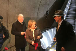 Metro General Manager Paul Wiedefeld; Jane Fairweather, of the Bethesda Chamber of Commerce task for on Metro, and Montgomery County Council President Roger Berliner cut the ribbon on the new escalators at the Bethesda Metro station. (WTOP/Dick Uliano)