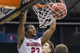 Illinois State forward Deontae Hawkins (23) dunks as San Francisco guard Frankie Ferrari (2) watches during the second half of an NCAA college basketball game at the Diamond Head Classic, Friday, Dec. 23, 2016, in Honolulu. San Francisco won p66-58. (AP Photo/Eugene Tanner)