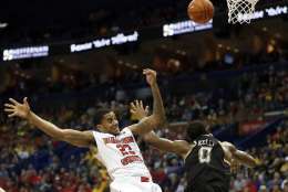Illinois State's Deontae Hawkins, left, loses control of the ball after colliding with Wichita State's Rashard Kelly during the first half of an NCAA college basketball game in the championship of the Missouri Valley Conference men's tournament, Sunday, March 5, 2017, in St. Louis. (AP Photo/Jeff Roberson)