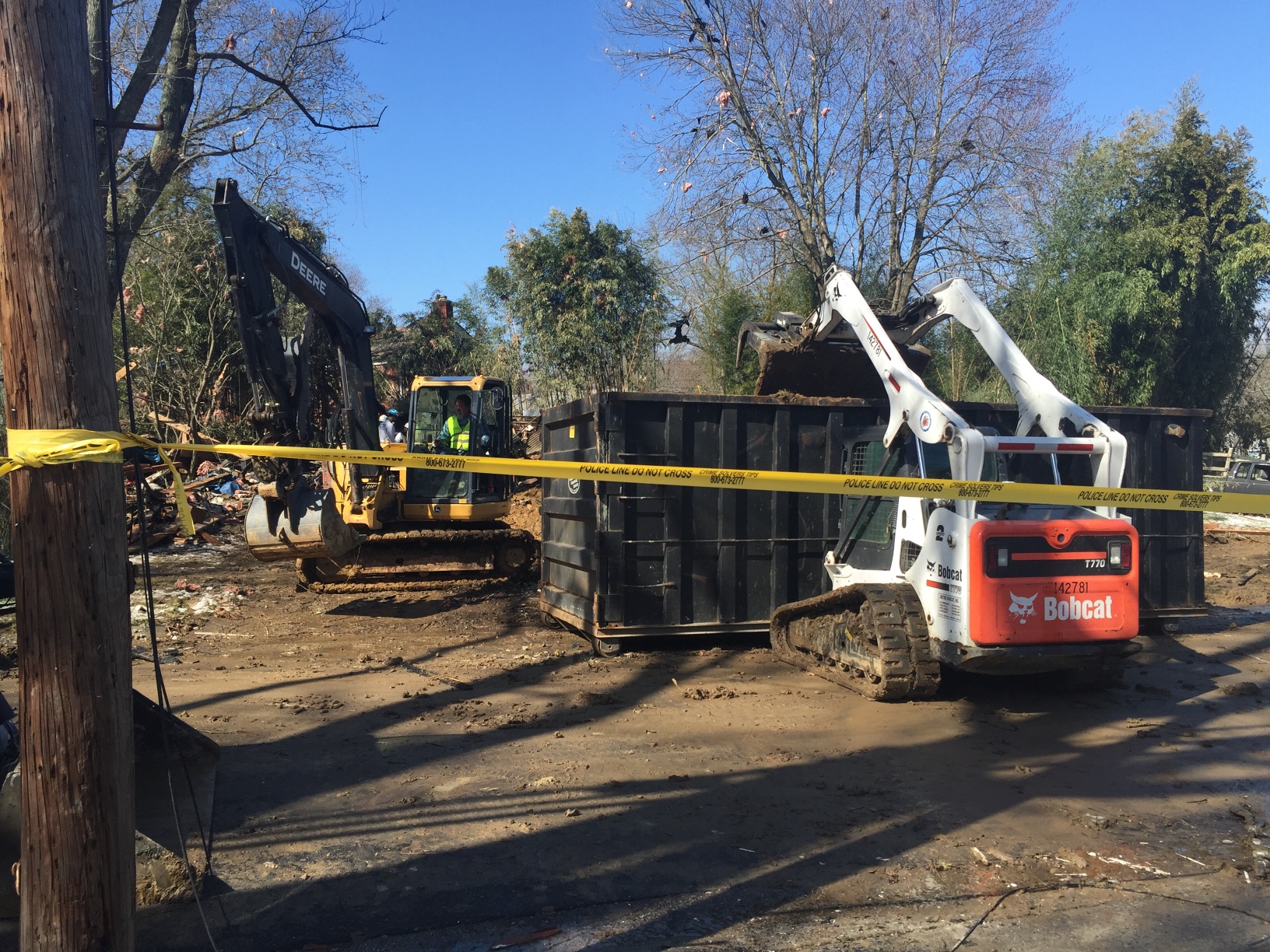 Equipment surrounds the scene of the home explosion that occurred Friday in Rockville, Md. (WTOP/Dennis Foley)
