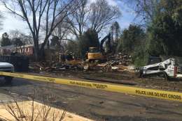 Caution tape surrounds the scene where a home exploded Friday in Rockville, Md. (WTOP/Dennis Foley)