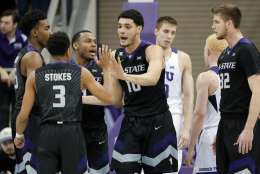 Kansas State 's Kamau Stokes (3), Isaiah Maurice (10) and Dean Wade (32) celebrate a basket against TCU in the second half of an NCAA college basketball game, Wednesday, March 1, 2017, in Fort Worth, Texas. (AP Photo/Tony Gutierrez)