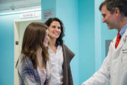 Kennedy Snyder and mother Kristy meet with Dr. Brian Rood, the director of clinical neuro-oncology at Children's National Health System. (Photo courtesy Sarah Kaupp/Sarah Kaupp Photography)
