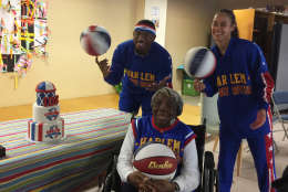 Buckets Blakes and Hoops Green, the 15thwoman to join the Globetrotters in the team's 91-year history joined with McLaurin visiting children at LAMB Public Charter School on Monday, March 13, 2017. (WTOP/Kristi King)