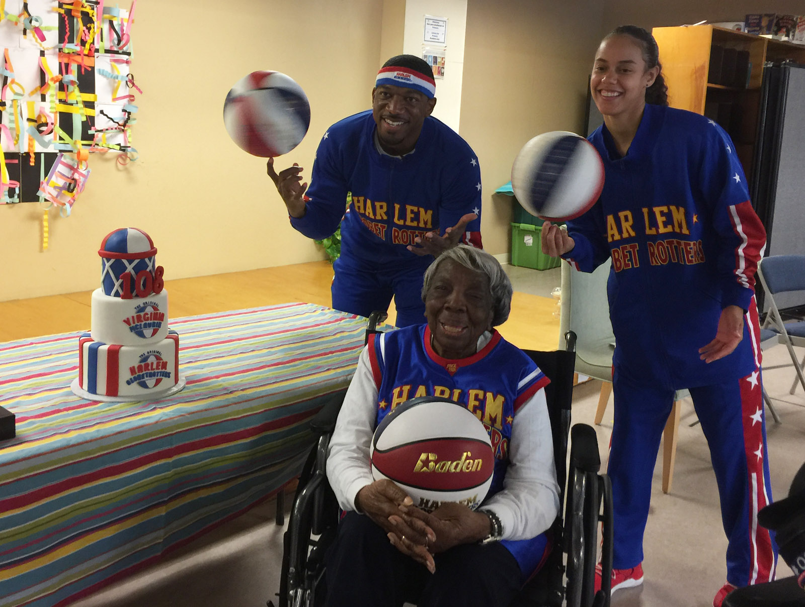 Buckets Blakes and Hoops Green, the 15thwoman to join the Globetrotters in the team's 91-year history joined with McLaurin visiting children at LAMB Public Charter School on Monday, March 13, 2017. (WTOP/Kristi King)
