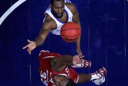NASHVILLE, TN - MARCH 12:  Dominique Hawkins #25 of the Kentucky Wildcats attacks the basket against Moses Kingsley #33 of the Arkansas Razorbacks during the championship game at the 2017 Men's SEC Basketball Tournament at Bridgestone Arena on March 12, 2017 in Nashville, Tennessee.  (Photo by Andy Lyons/Getty Images)
