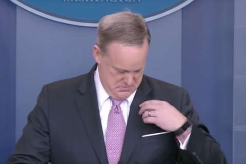 Spicer’s flag-pin faux pas amuses press, Twitter