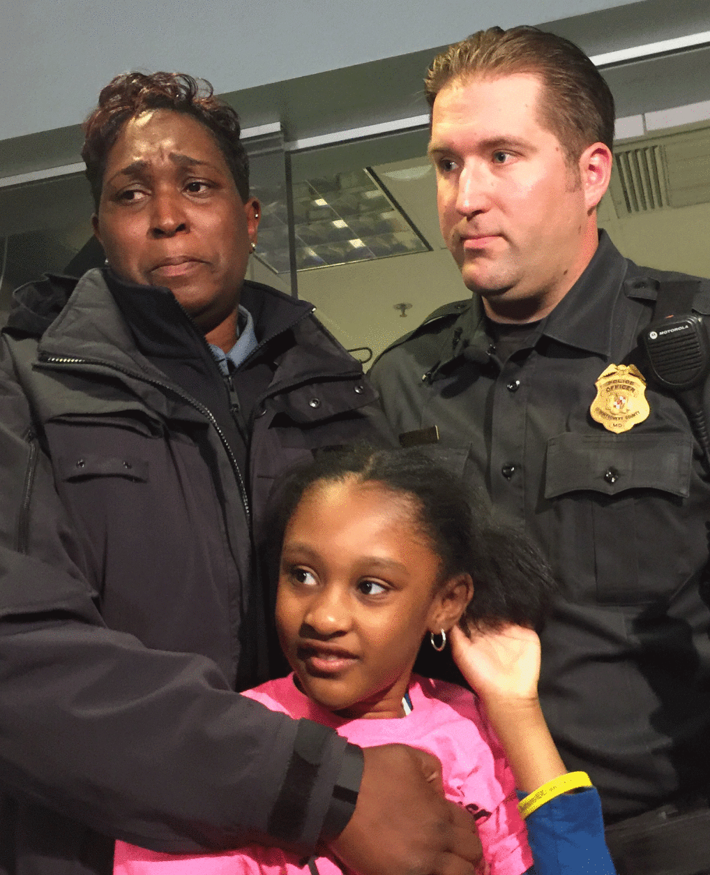 "I am forever grateful," Mary Wimpy told Montgomery County Police Officer Jonathon Pruziner. Pruziner knew to look for Sahara, 7 near a local pond because he said, departmental training taught him autistic children are attracted to water. (WTOP/Kristi King)
