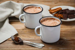 Hot chocolate on rustic wooden table, selective focus