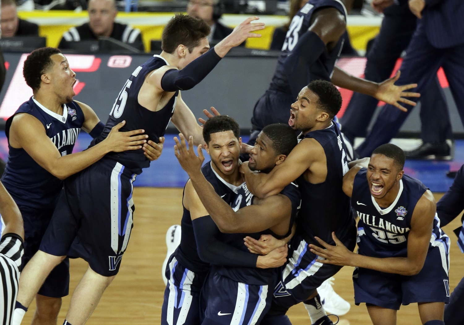 ADVANCE FOR WEEKEND EDITIONS, NOV. 5-6 - FILE - In this April 4, 2016, file photo, Villanova players celebrates after Kris Jenkins, center, made the game-winning basket as they defeated North Carolina 77-74 in the championship game of the the NCAA Final Four college tournament in Houston. The Wildcats reign as champions for the first time in three decades. (AP Photo/Charlie Neibergall, File)