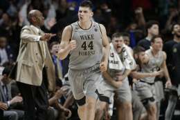 Wake Forest's Konstantinos Mitoglou (44) celebrates after a basket against Louisville during the second half of an NCAA college basketball game in Winston-Salem, N.C., Wednesday, March 1, 2017. Wake Forest won 88-81. (AP Photo/Chuck Burton)