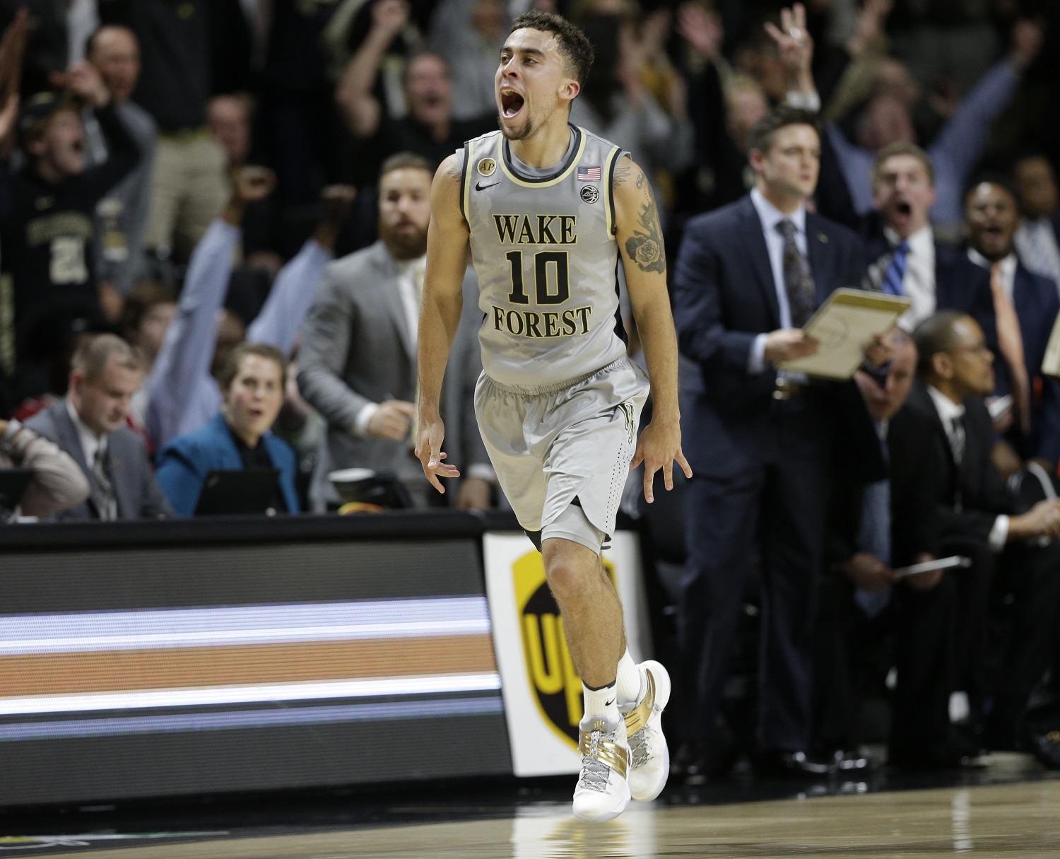 Wake Forest's Mitchell Wilbekin (10) reacts after making a basket against Louisville in the second half of an NCAA college basketball game in Winston-Salem, N.C., Wednesday, March 1, 2017. Wake Forest won 88-81. (AP Photo/Chuck Burton)
