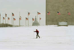 A lone skier crosses the Mall in front of the Washington Monument, March 14, 1993. Much of downtown Washington was deserted Sunday morning as they city began to recover from one of the biggest winter storms in recent years. (AP Photo/Doug Mills)