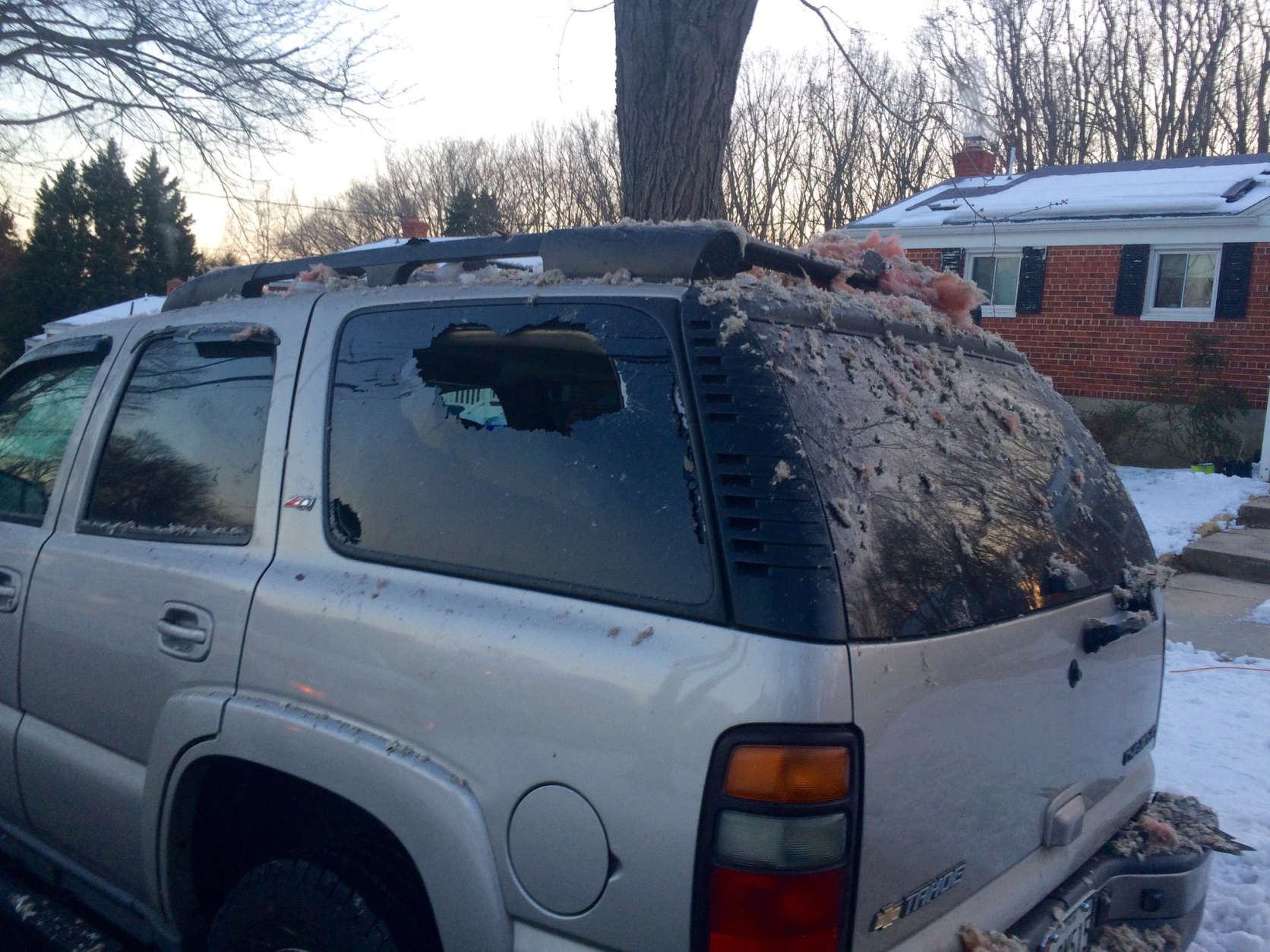 An SUV parked near the explosion was damaged, and was covered with debris Friday morning. (WTOP/Nick Iannelli)