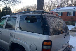 An SUV parked near the explosion was damaged, and was covered with debris Friday morning. (WTOP/Nick Iannelli)