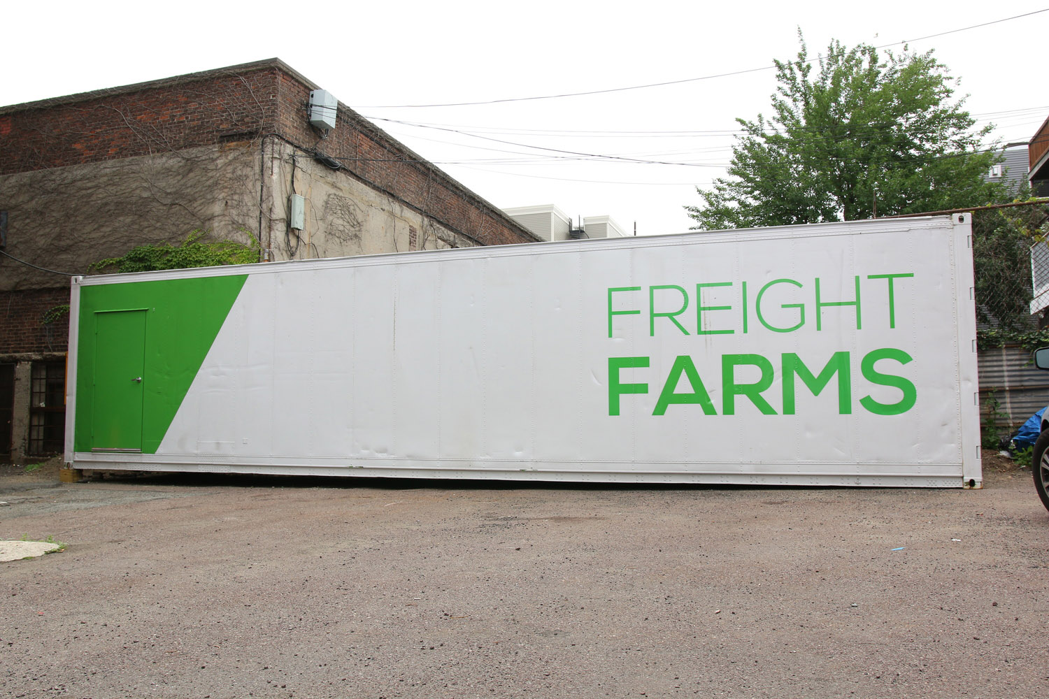 A shipping container farm sits outside of Freight Farms headquarters in Boston in this photo provided by Freight Farms. The company retrofits shipping containers to grow hydroponic produce. Rockville-base Federal Realty Investment Trust has a deal to rent parking spots at it shopping centers to farmers. (Courtesy Freight Farms)