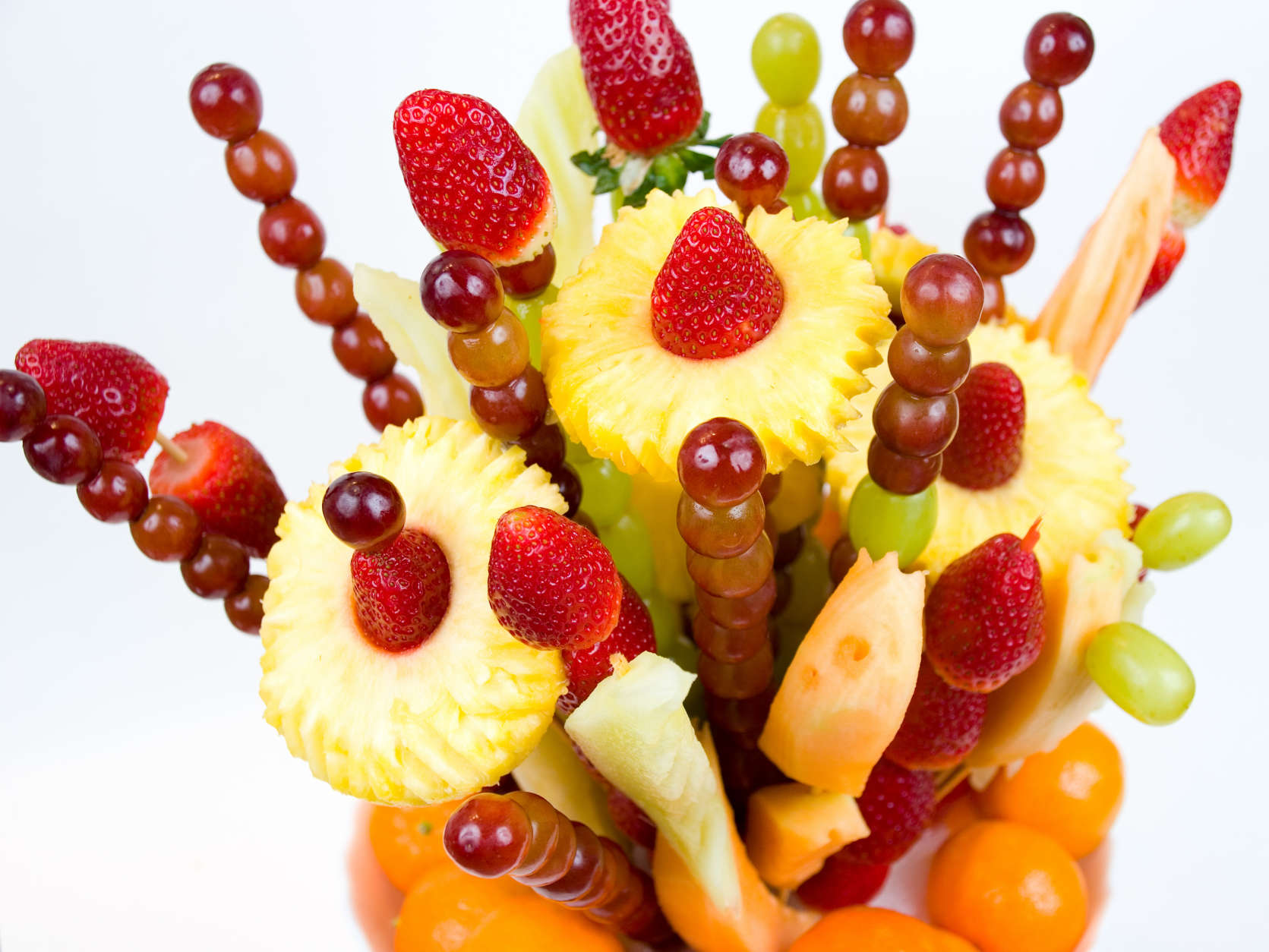 A fruit bouquet shot with shallow DOF on a white background