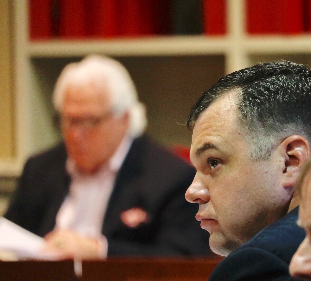Sen. JB Jennings (foreground) and Senate President Thomas V. Mike Miller (background) at the Monday hearing for Schrader. (WTOP/Kate Ryan)