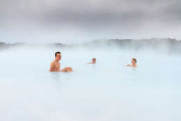 Sick people healing in the blue mineral waters of a geothermal spa in Iceland
