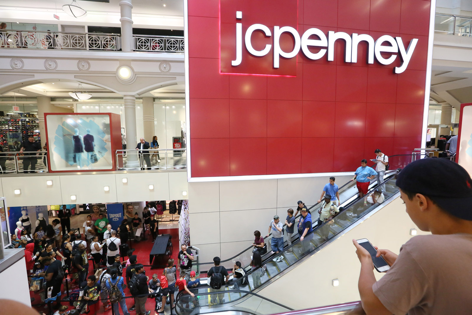 Crowds line up at JCPenney in the Manhattan Mall, New York City, Thursday,  August 18, 2016. No J.C. Penney stores in the D.C. region are slated to close as part of the retailer's turnaround plan. (Photo by Stuart Ramson/Invision for JCPenney/AP Images)