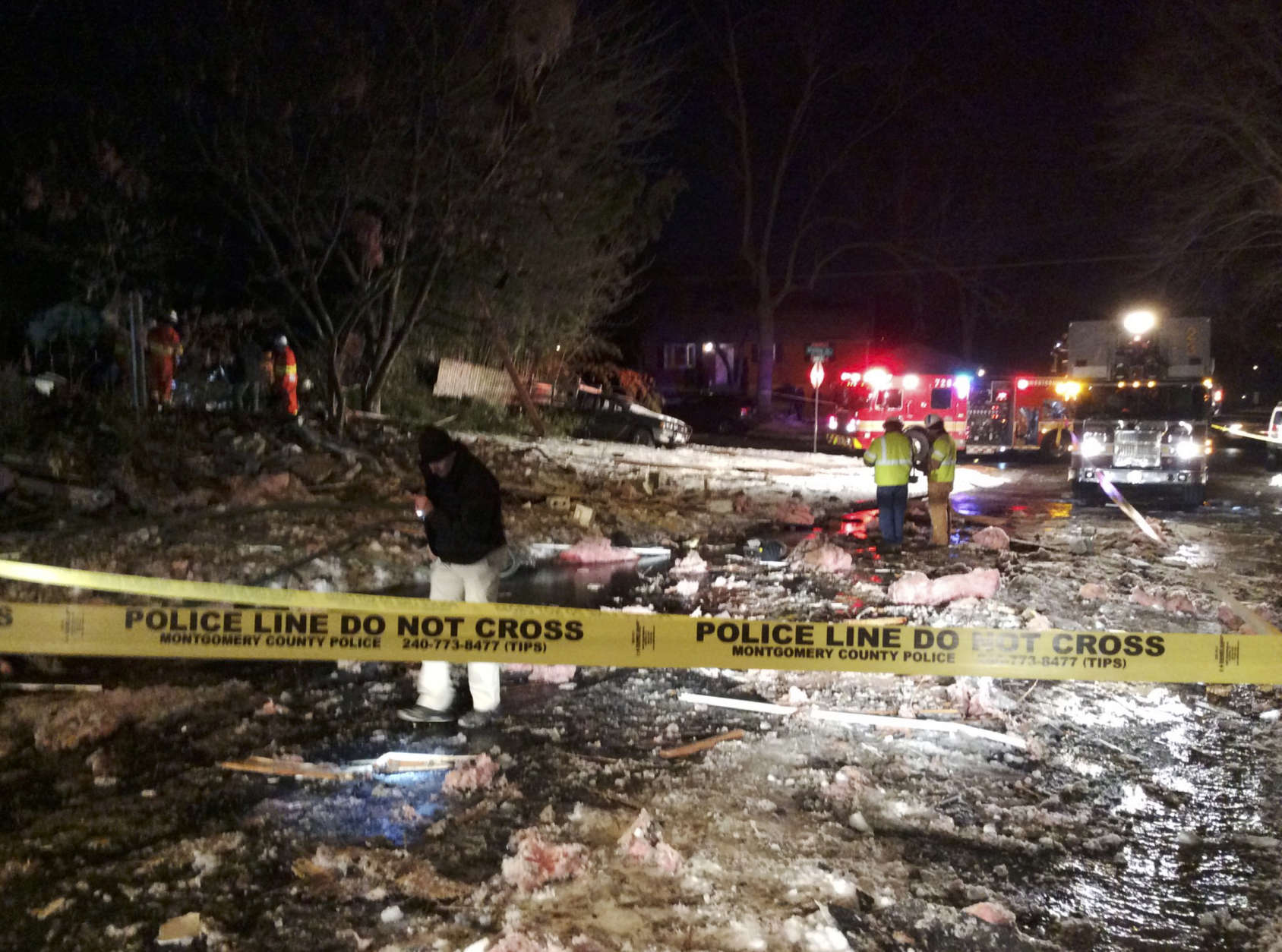 In this photo provided by the Montgomery County fire &amp; Rescue Service, emergency personnel work at the scene of a leveled house in Rockville, Md., Friday, March 17, 2017. Authorities said the explosion occurred about 1 a.m. Friday and reduced the home to a "pile of bricks." (Montgomery County fire &amp; Rescue Service via AP)