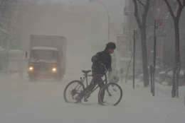 A cyclist makes his way across a New York street  March 13, 1993. The storm that dumped 13.9 inches of snow at Dulles International Airport enveloped the eastern third of the country.
(AP Photo/Robert Clark)