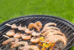 Delicious grilled prawns on burning coals