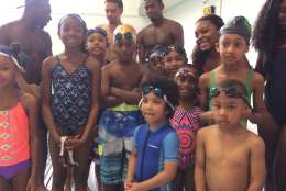 Kids learned how to swim from the Howard University Swim Team and USA Swimming's Maritza McClendon on Saturday. (WTOP/Dick Uliano) 