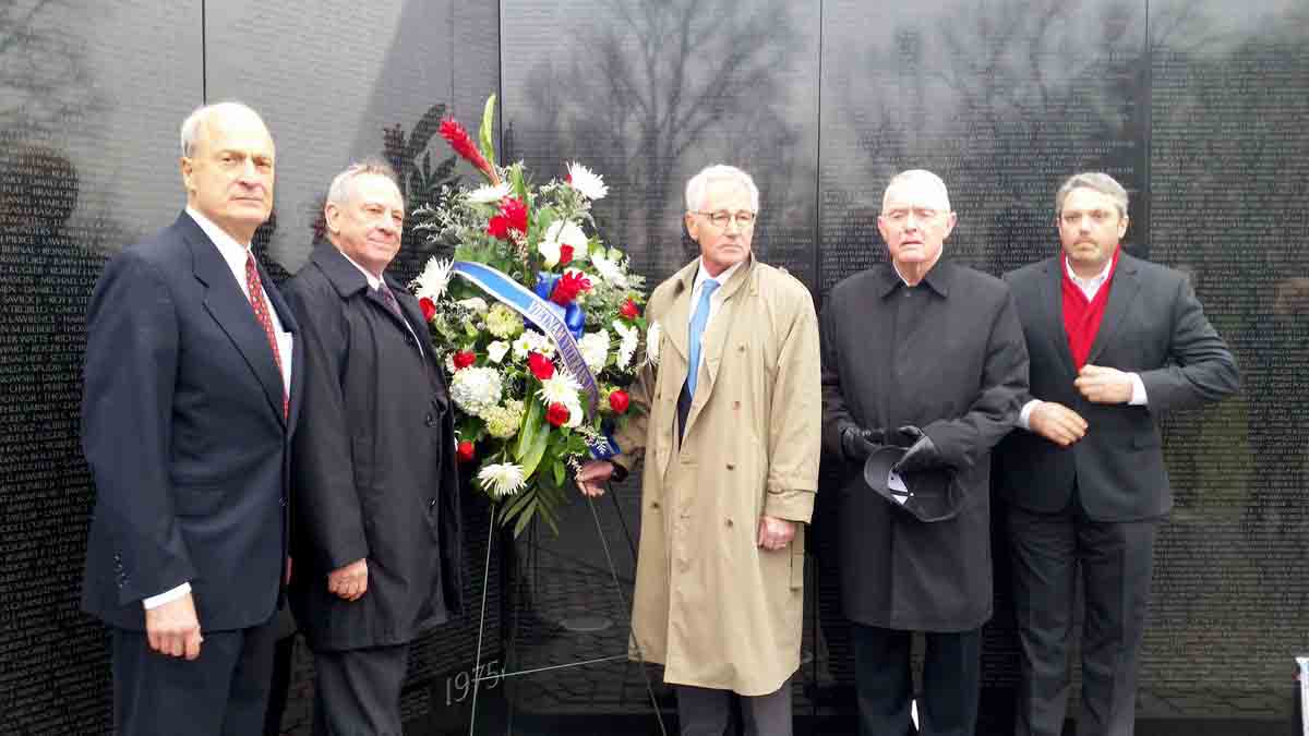 (From left to right): Bob Doubek, former executive director of the Vietnam Veterans Memorial Fund; Jan Scruggs, founder of the VVMF; Former Defense Sec. Chuck Hagel; Gen. Barry McCaffrey and Bob Knotts, president of VVMF. (WTOP/Kathy Stewart)