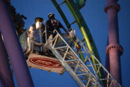 A stuck roller coaster at the Upper Marlboro, Maryland, Six Flags amusement park that had suspended 24 riders 80 feet in the air April 13, 2017. It took 50 fire fighters from Prince George's and Anne Arundel counties about four hours to rescue the riders. (Courtesy Mark Brady/Prince George's County Fire Department)
