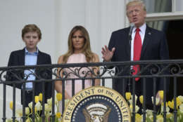 President Donald Trump, with first lady Melania Trump and their son Barron Trump, speaks from the Truman Balcony of the White House in Washington, Monday, April 17, 2017, during the annual White House Easter Egg Roll on the South Lawn.  (AP Photo/Susan Walsh)