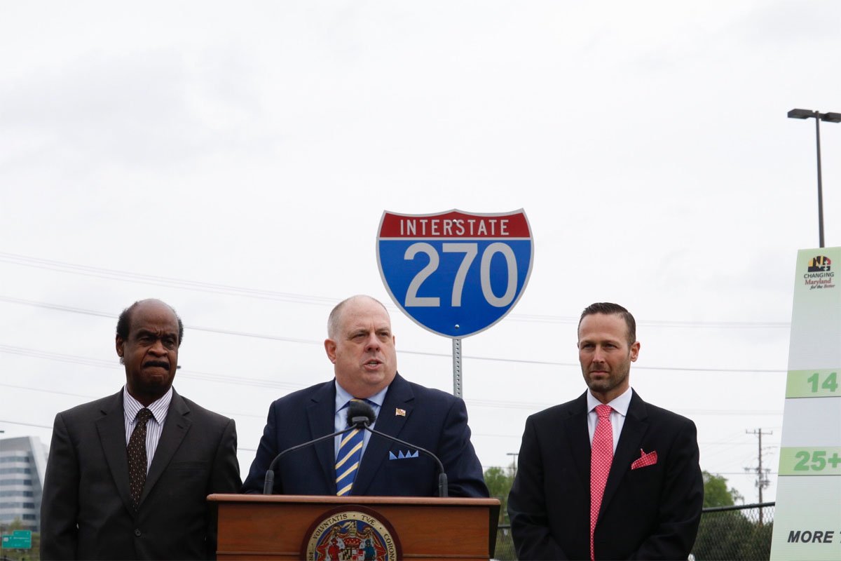 Maryland Gov. Larry Hogan (center) outlined his $100 million plan to ease congestion on Interstate 270 in Montgomery County. He was joined by Montgomery County Executive Isiah "Ike" Leggett (left) and Maryland State Highway Administration Greg Slater. (WTOP/Kate Ryan)